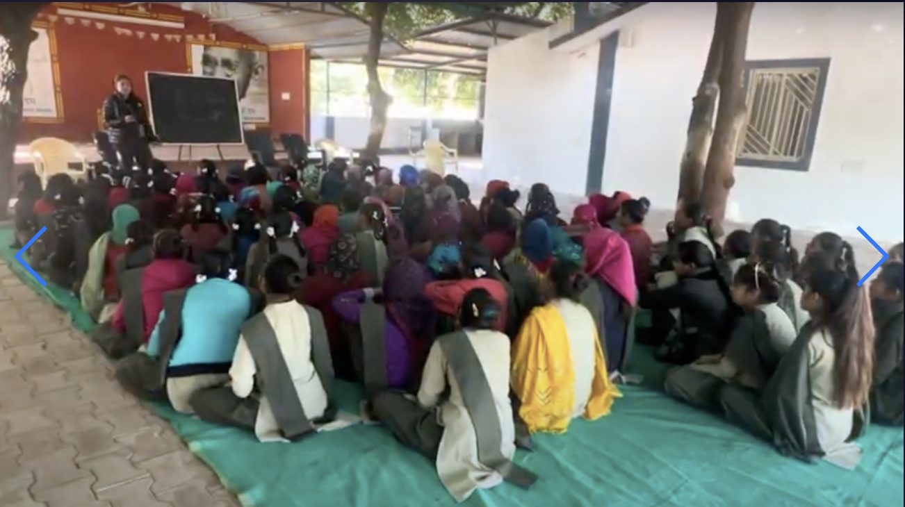 Girls seated on a mat during a BleedBOLD school awareness session